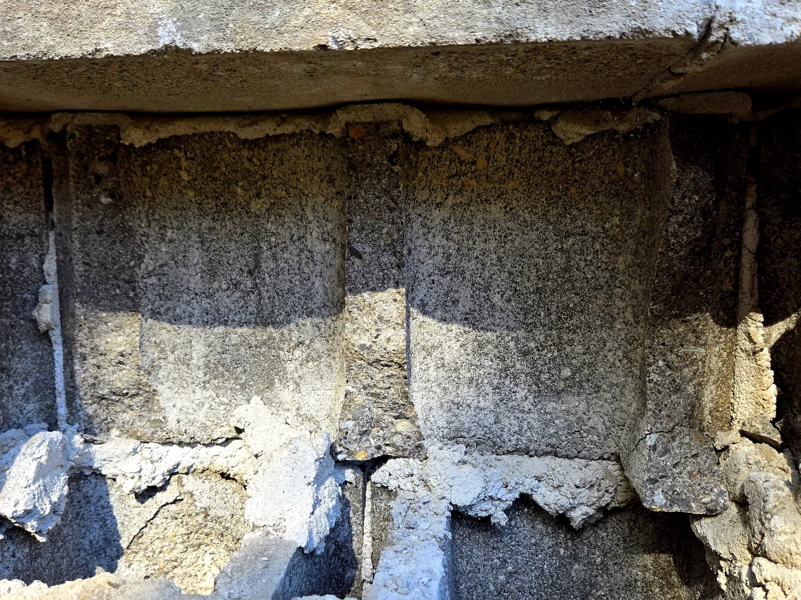 Deteriorated concrete block surface needing restoration
