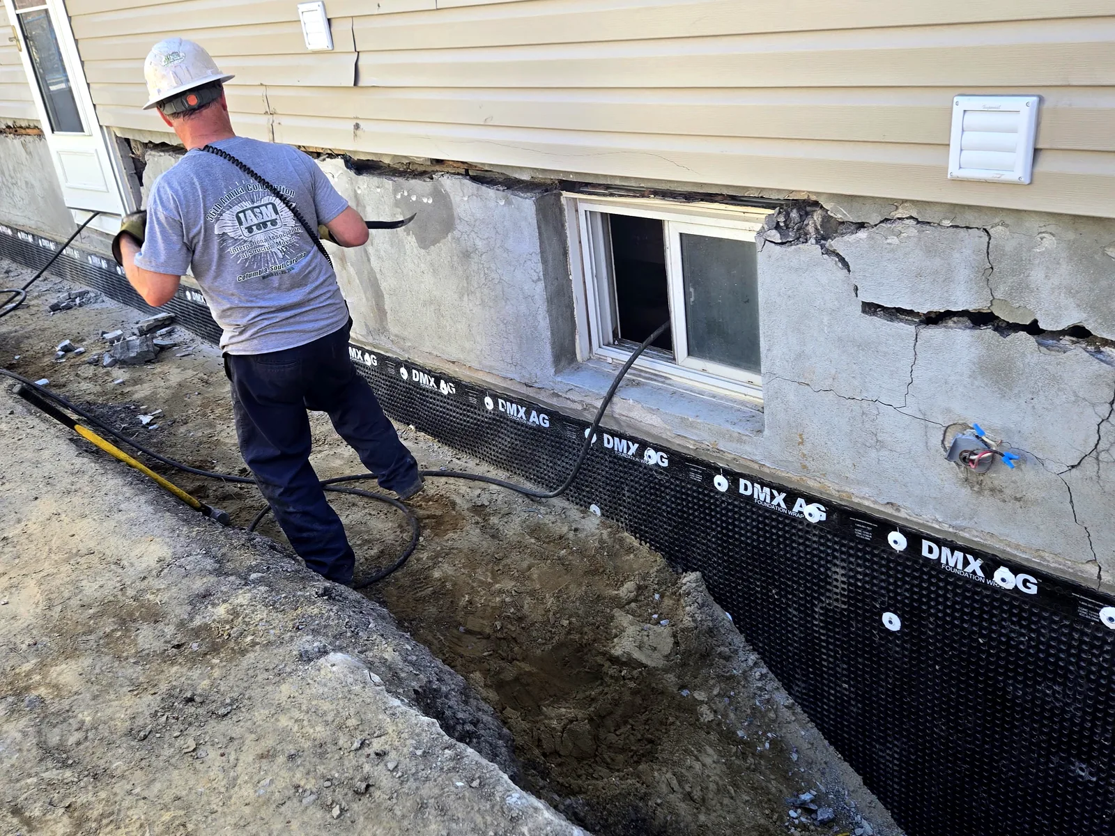 Stacy Provost at an Ottawa foundation, mid-exterior-waterproofing job